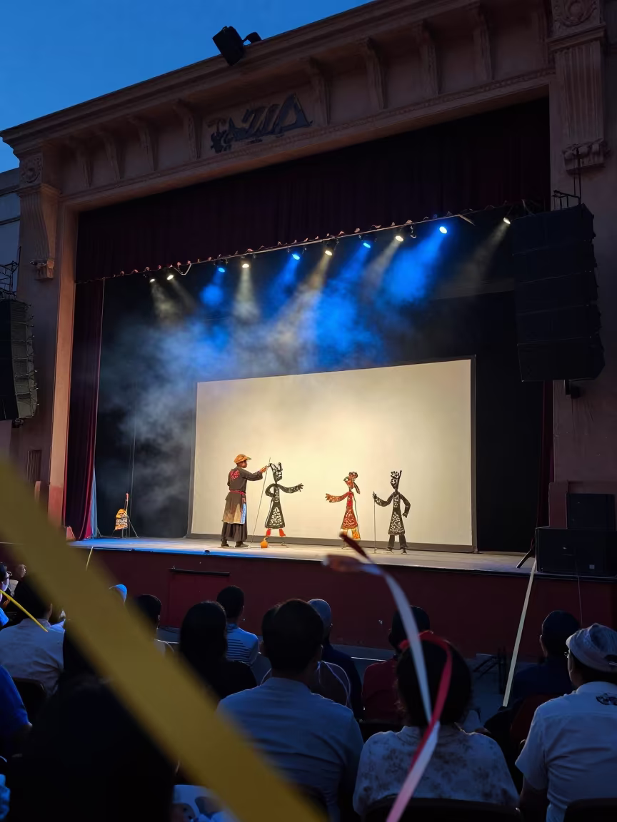 Shadow Puppet Master in Taza Theater in on a theater stage in Taza