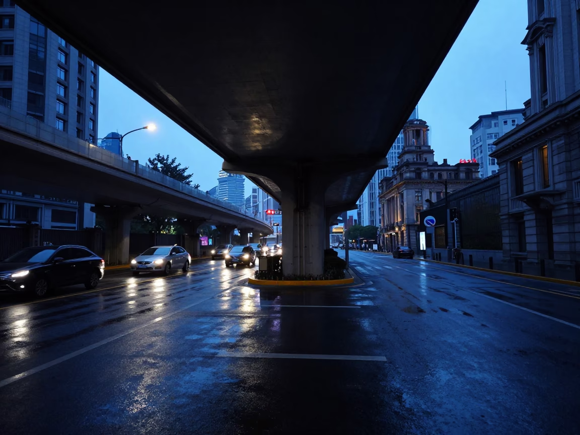 Shanghai China pre-dawn street scene with flyover shadows and wet pavement reflections in in Shanghai, China