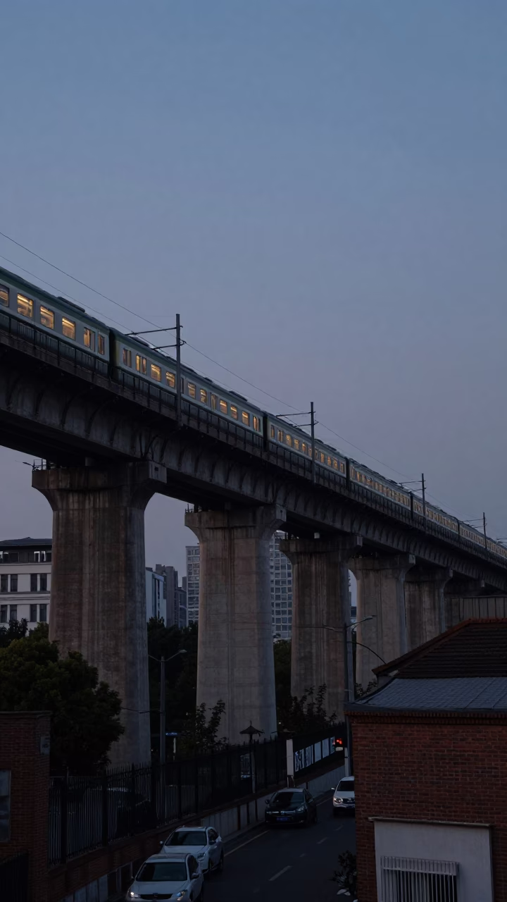 Shanghai China predawn railway viaduct with passing train and brick wall ivy in in Shanghai, China