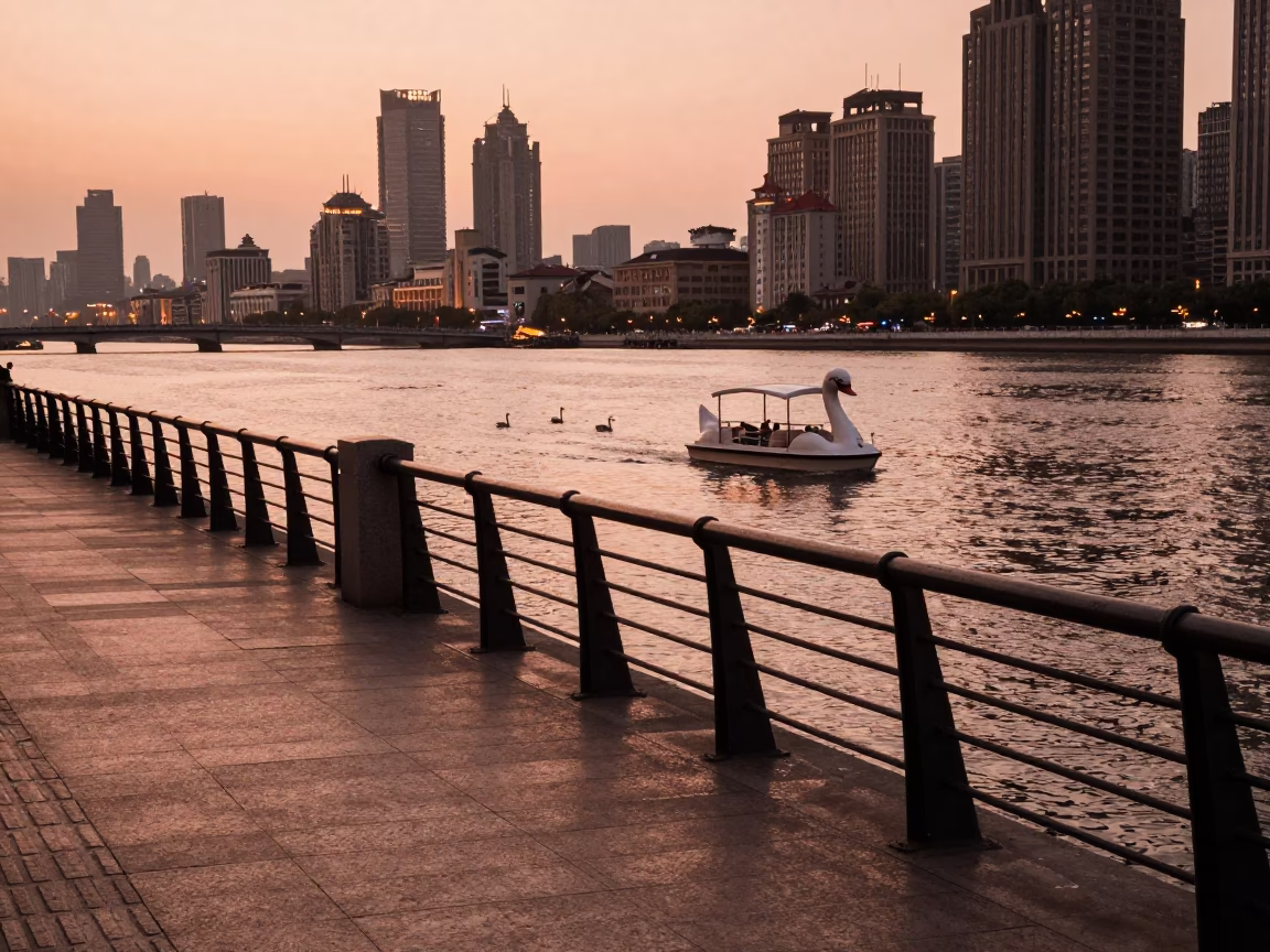Shanghai Huangpu River Promenade at Dusk with Swans and Urban Skyline in in Shanghai, China