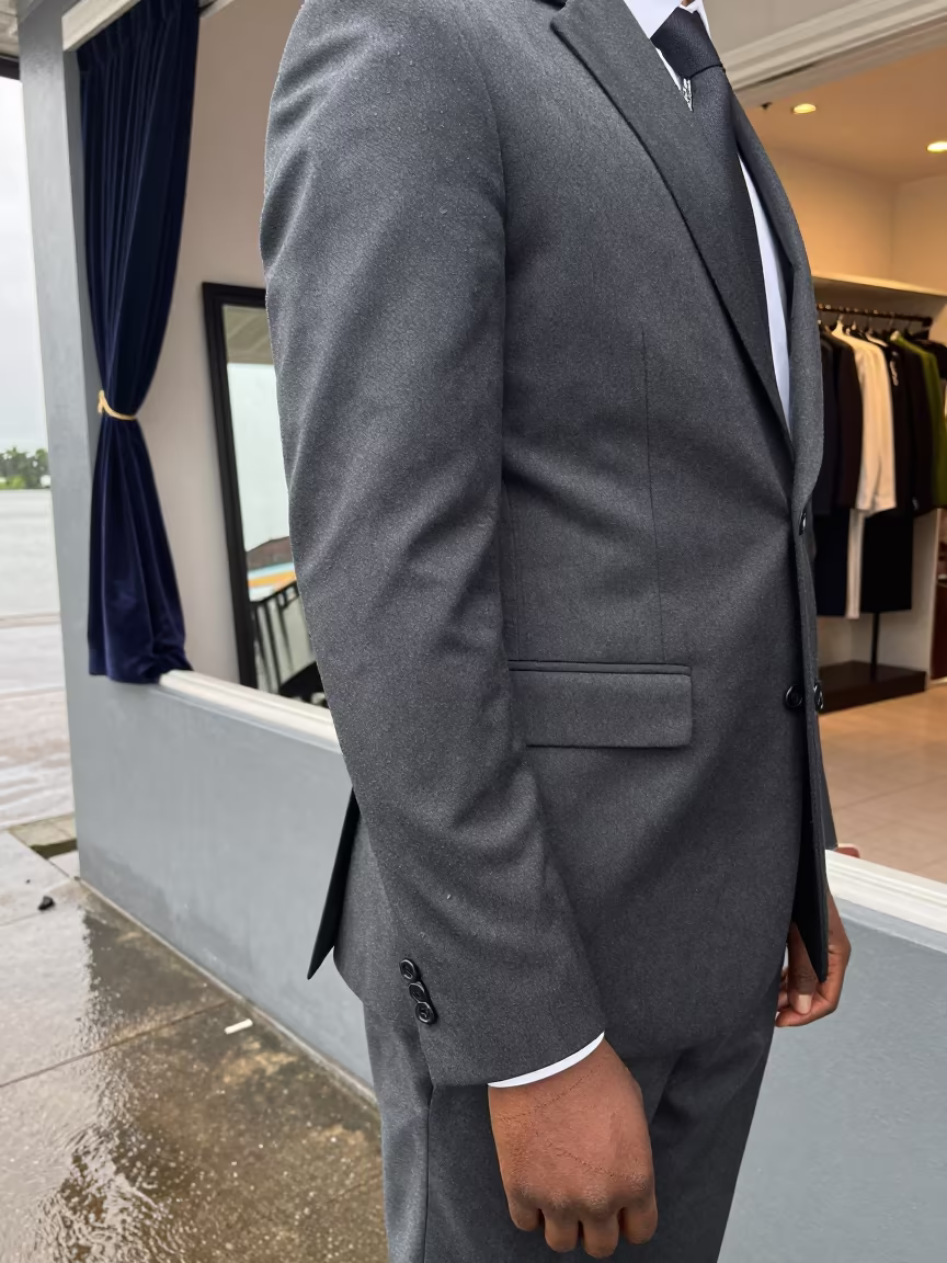 Sharp Suiting Texture Against Dar es Salaam Harbor Wall in against a wind-beaten harbor wall near Dar es Salaam