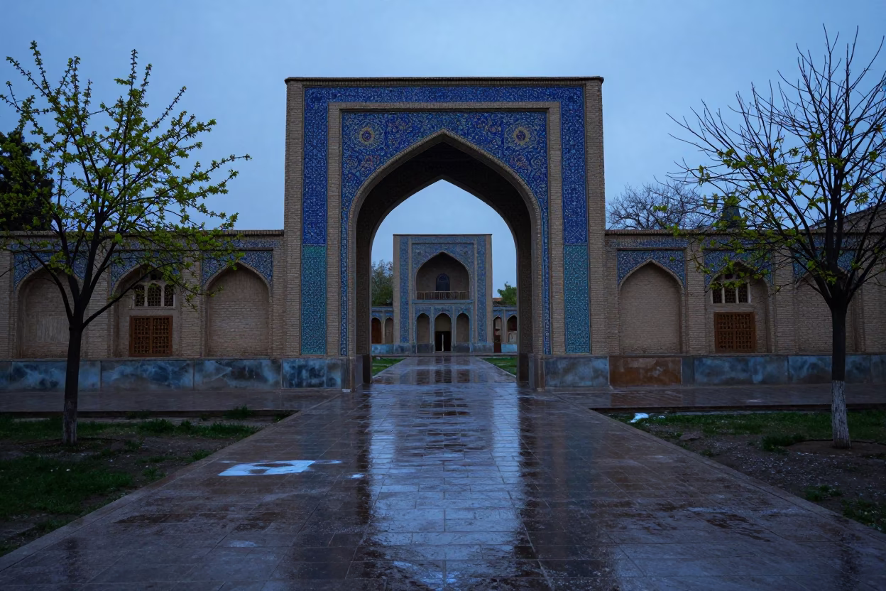 Shiraz Campus Archway Blue Hour Spring in across a rain-washed campus courtyard in Shiraz