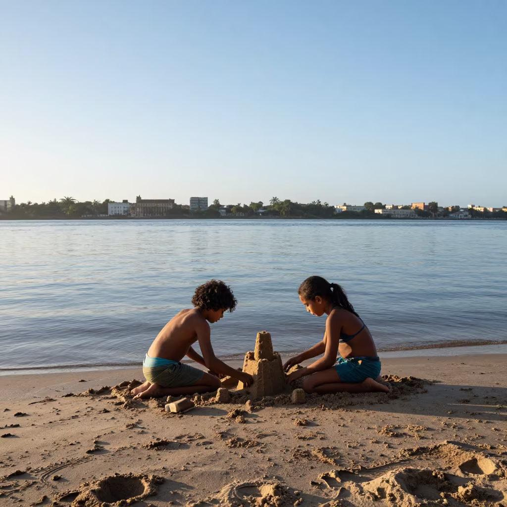 Siblings Build Sandcastle at Havana Riverside in near a riverside landing in Callejon de Hamel, Havana