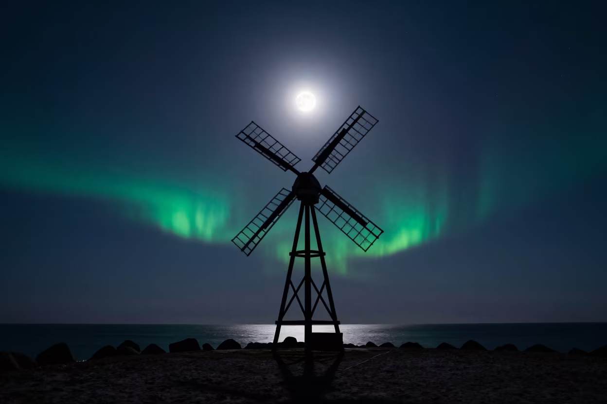 Silent Windmill Under Moonlit Midnight Sun in from a moonlit breakwater near Whitehorse