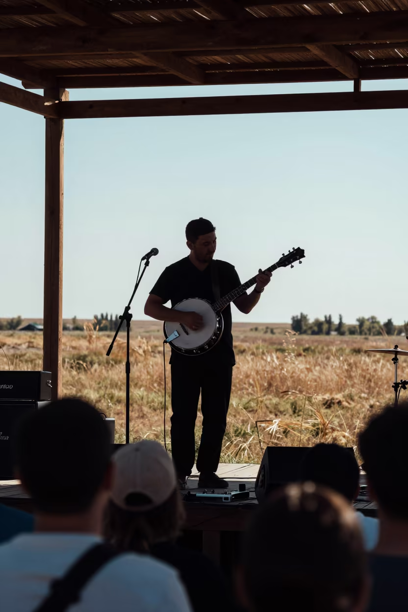 Silhouette of Banjo Picker on Semey Festival Stage in on a festival main stage in Semey