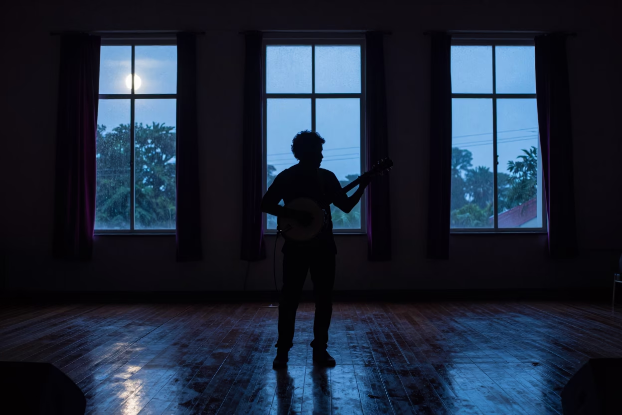Silhouette Banjo Player on Concert Hall Stage in in a concert hall in Cuttack
