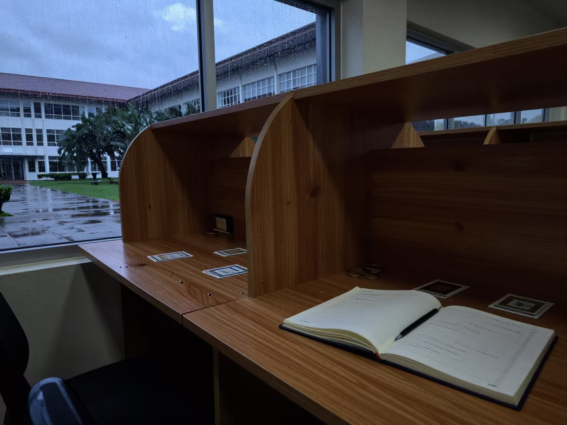 Silhouette Study Carrel in Cebu Library Stacks in across a rain-washed campus courtyard in Cebu