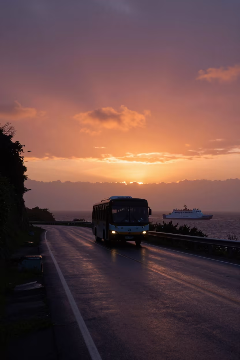 Silhouetted Bus on Coastal Hairpin Turn Sunset in across a remote ferry crossing near Sao Luis
