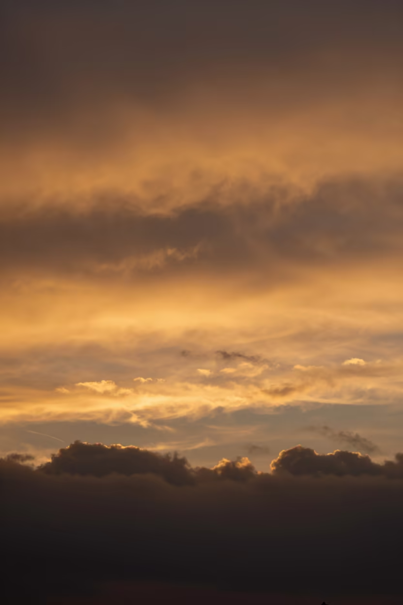 Silhouetted Cloud Bands at Amber Sunset Markham in beneath fast-moving cloud bands near Markham