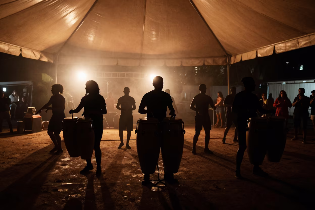 Silhouetted Drummer Leads Carnival Line in under a circus tent in São Paulo