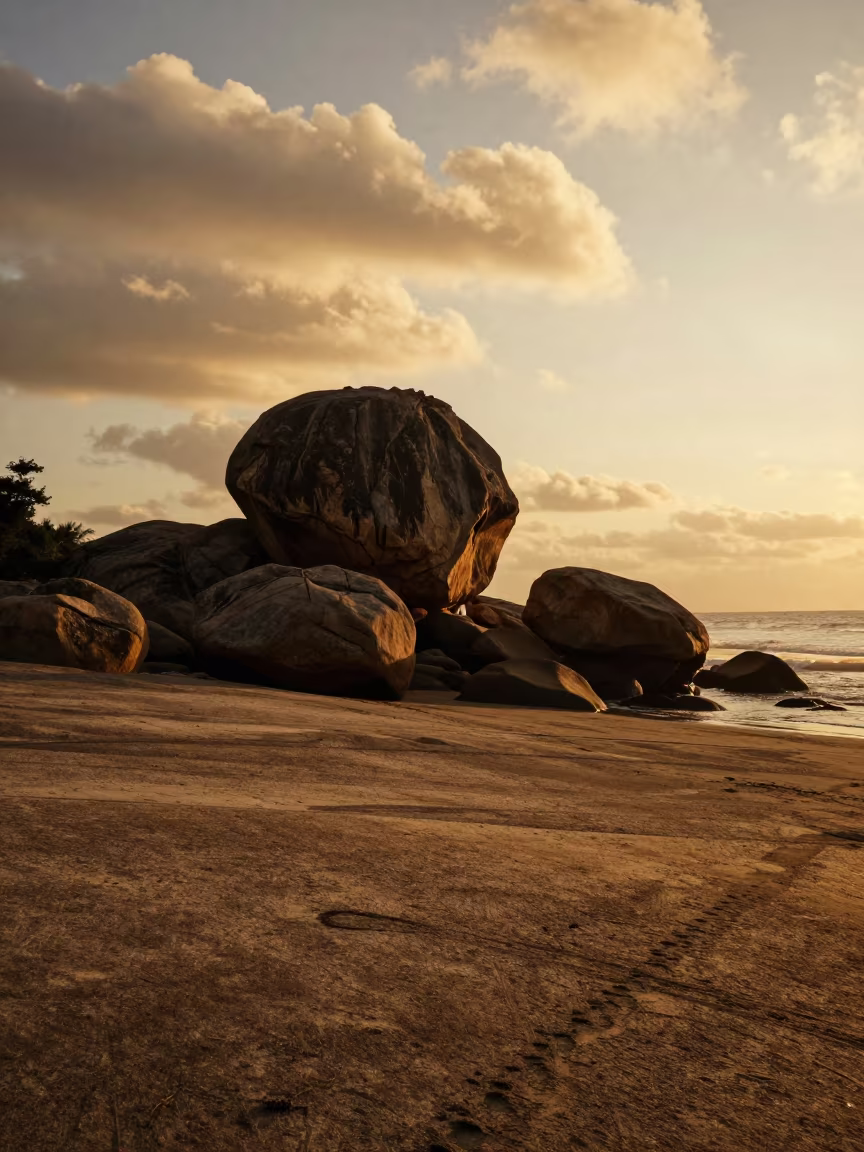 Silhouetted Erratic Boulder on Golden Shoreline in along a wave-cut shoreline near Hyderabad
