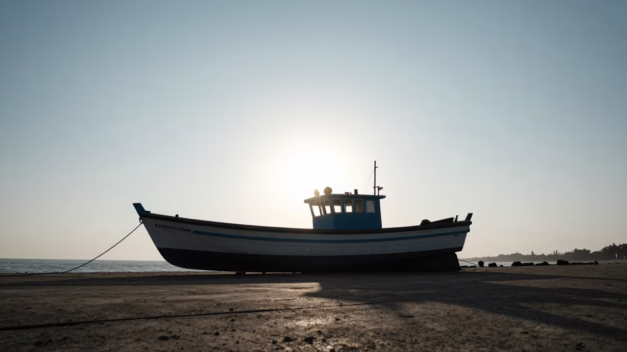 Silhouetted Fishing Boat on Mumbai Causeway in on a wind-open causeway near Mumbai