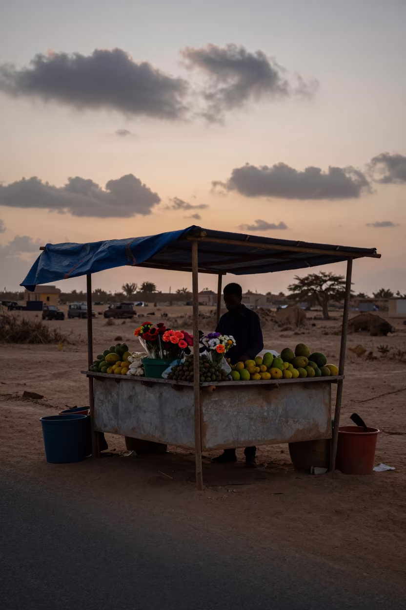 Silhouetted Flower Stall in Nouadhibou Before Dusk in at a roadside fruit stand in Nouadhibou