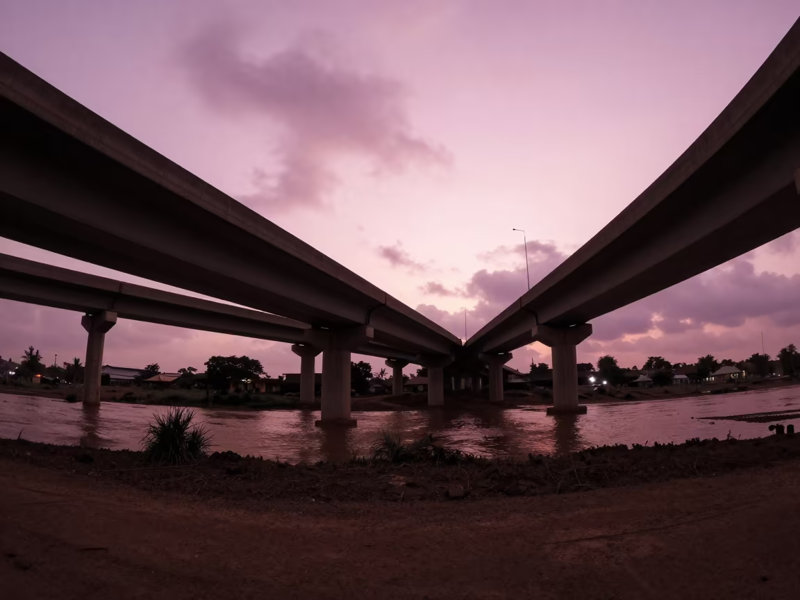 Silhouetted Flyover Stack Over Ikeja Floodwater in along a levee path above floodwater near Ikeja