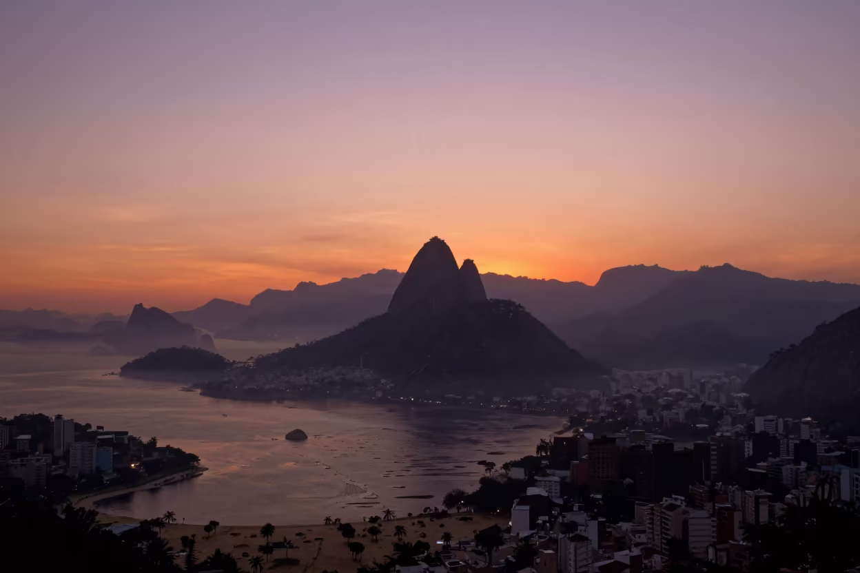 Silhouetted Hoodoo Spire at Sunset Over Valley Fog in across a wide valley floor in Rio de Janeiro state