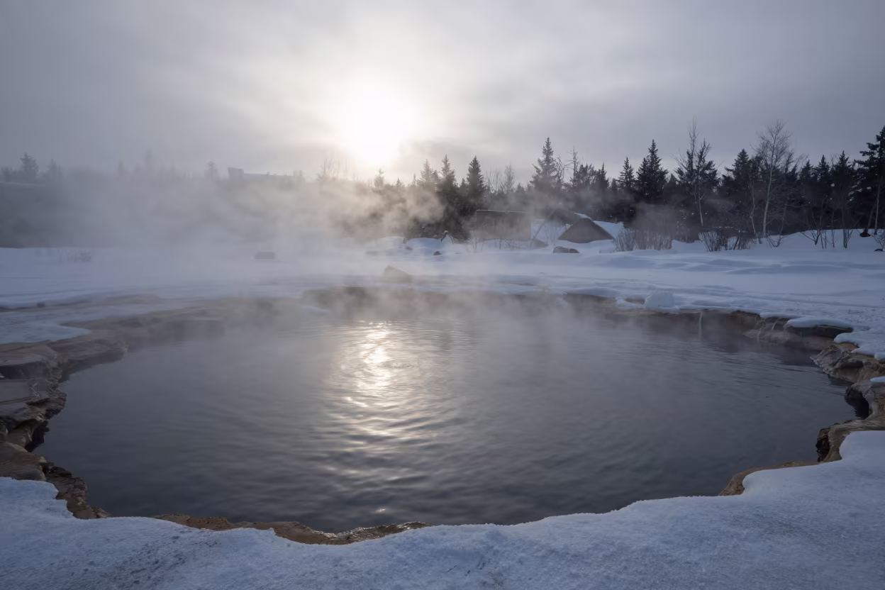Silhouetted Hot Spring Pool Amidst Snow in near Murmansk