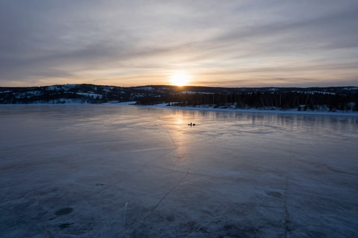 Silhouetted Ice Cracks on Siberian Floodplain at Sunset in across a floodplain after rain in Siberia