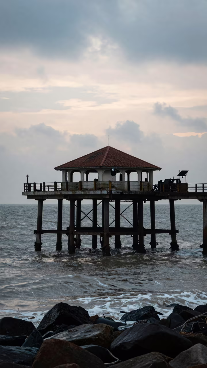Silhouetted Iron Pier Ruin After Rain in inside a roofless nave near Mumbai