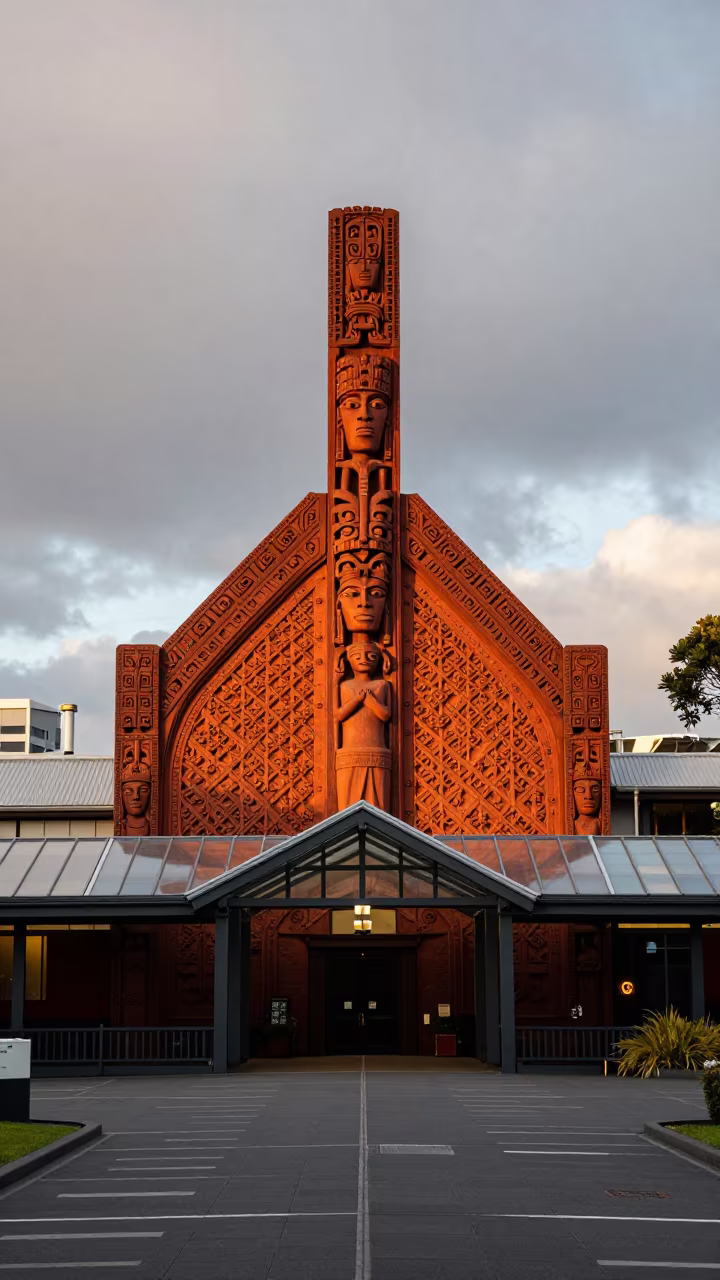 Silhouetted Maori Meeting House Autumn Evening in inside a glass-roofed arcade in Wynyard Quarter, Auckland