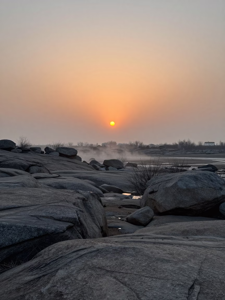 Silhouetted Moraine Boulders in Early Winter Valley in across a wide valley floor near Suzhou