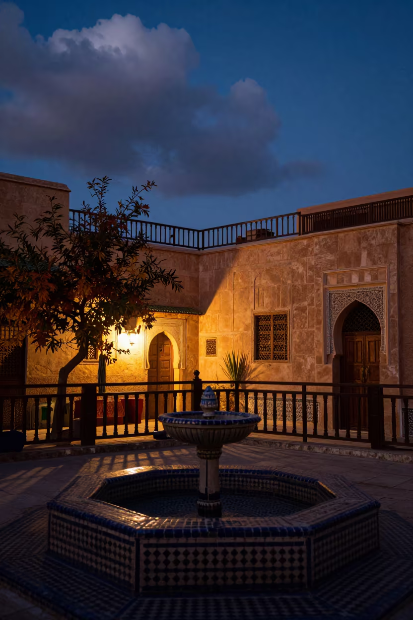 Silhouetted Moroccan Riad Terrace at Autumn Twilight in in a riad courtyard in Gueliz, Marrakech