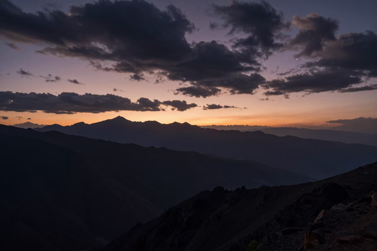 Silhouetted Mountain Ridge Under Starry Sky at Sunset in near Thimphu