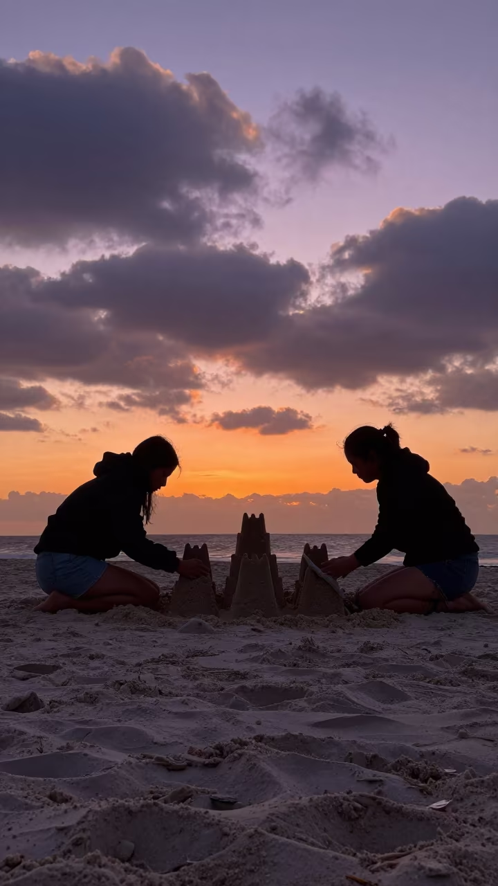 Silhouetted Sandcastle Builders at Cape Town Sunset in in Cape Town