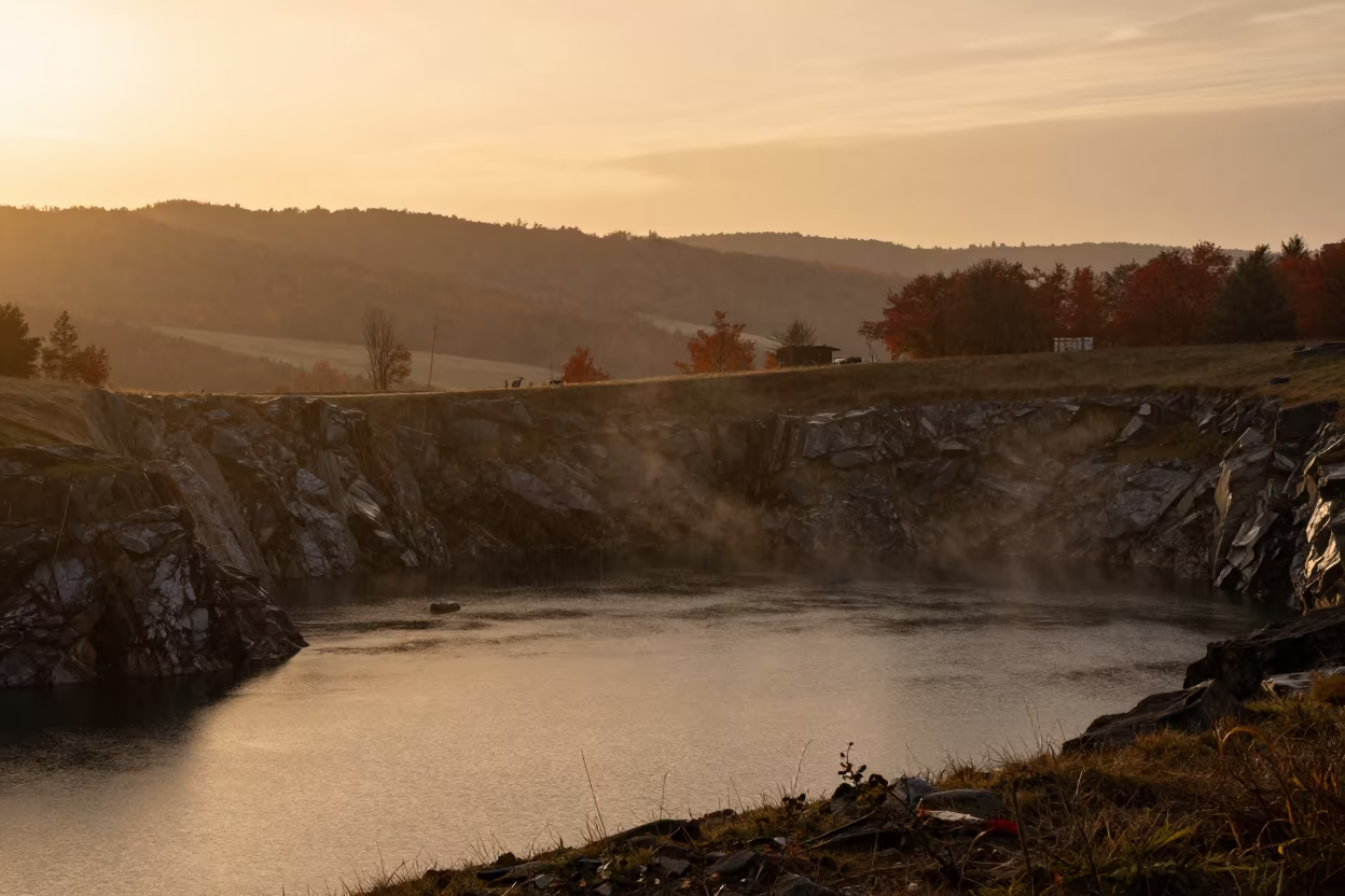 Silhouetted Sinkhole Lake in Belgian Valley at Golden Hour in across a wide valley floor in Belgium