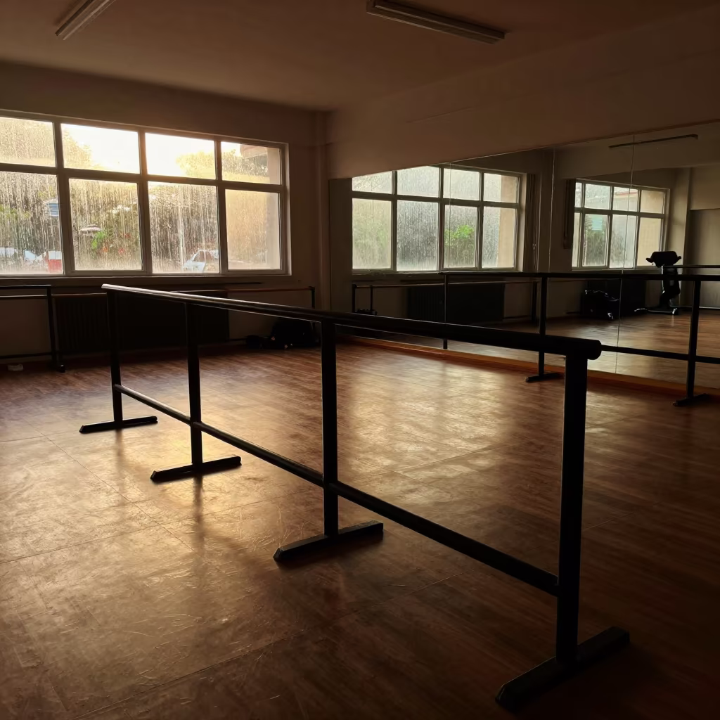 Silhouetted Spin Studio Cue Rail at Golden Hour in inside a spin studio under class lights in Nacala