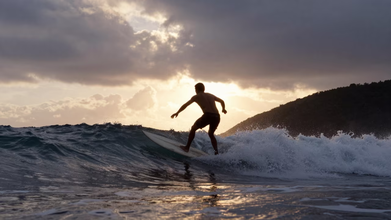 Silhouetted Surfer Bottom Turn at Sunset in on a hillside near Maceio