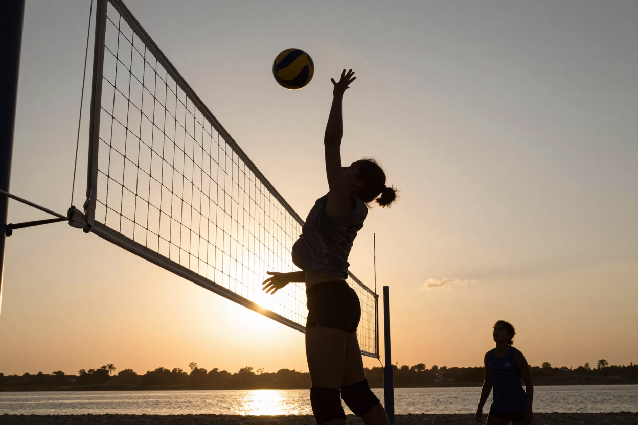 Silhouetted Volleyball Spike at Carúpano Riverbank Sunset in by a riverbank near Carúpano