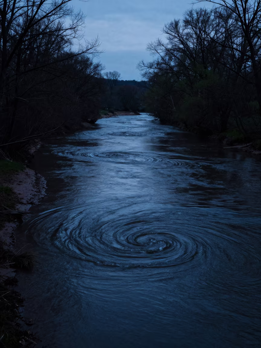 Silhouetted Whirlpool in Pennsylvania Twilight in across a floodplain after rain in Pennsylvania