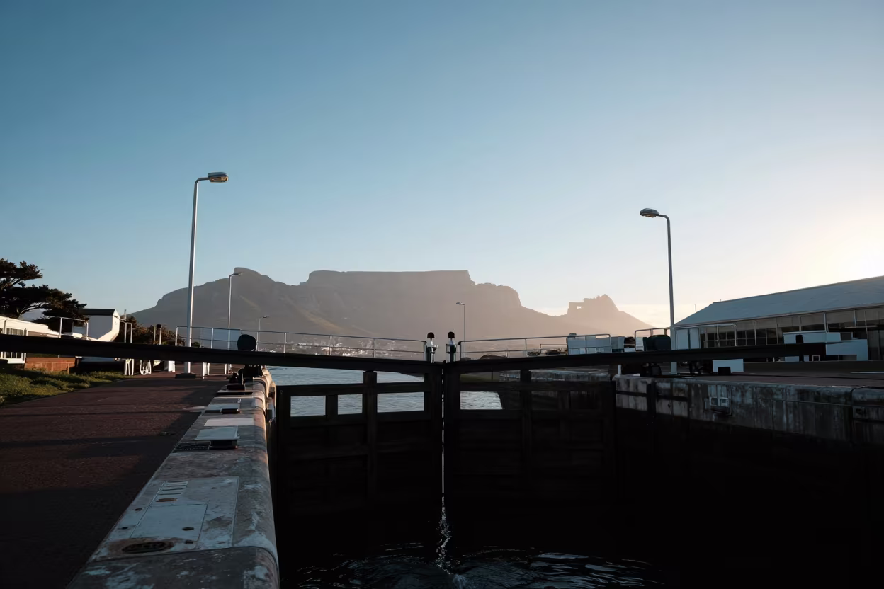 Silhouetted Wooden Canal Lock Gates Over Cape Town Interchange in across a windy overpass interchange in Cape Town