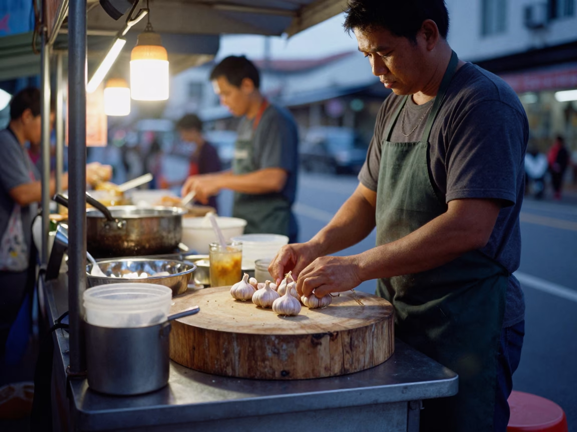 Singapore Pre-Dawn Street Food Stall Setup with Garlic and Cooking Tools in in Singapore, Singapore