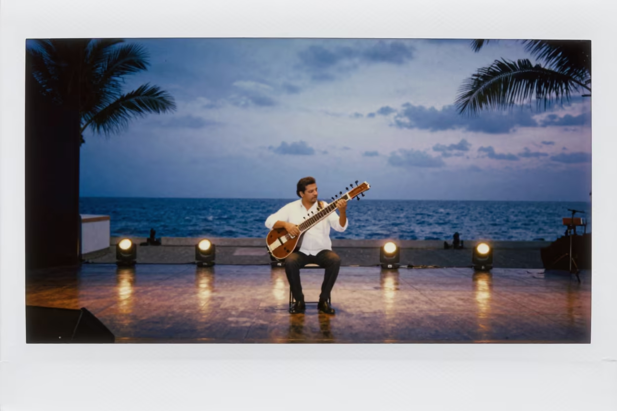Sitar Master on Cabo Stage at Twilight in on a theater stage in Cabo San Lucas