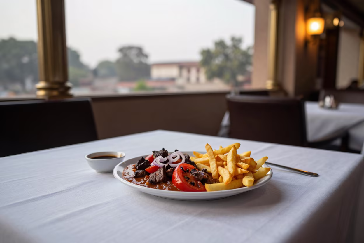 Sizzling Lomo Saltado Fries Delhi Table in on a linen-covered restaurant table in Nizamuddin, Delhi