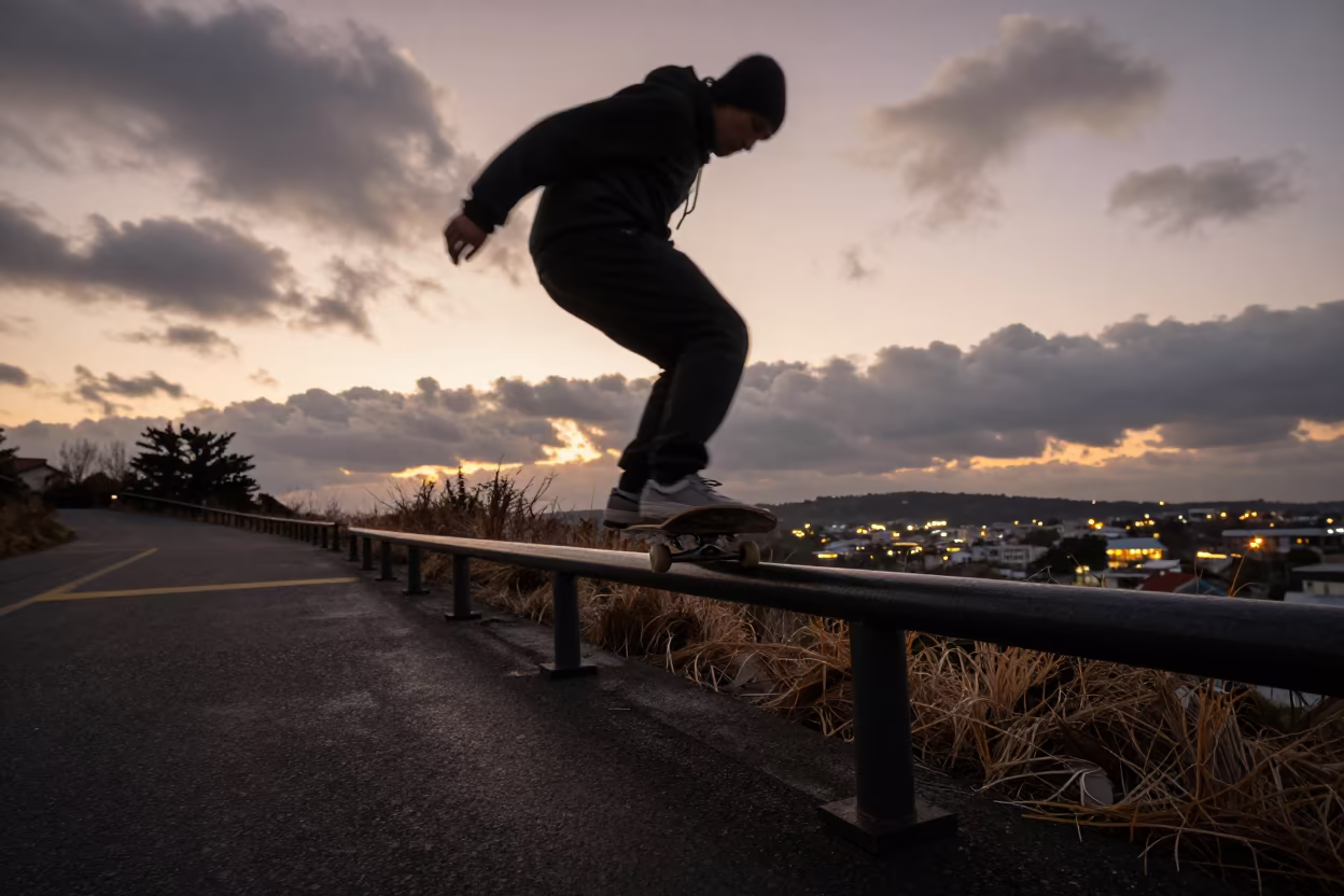 Skateboarder Grinding Rail at Jeju Dusk in at a roadside stop near Jeju