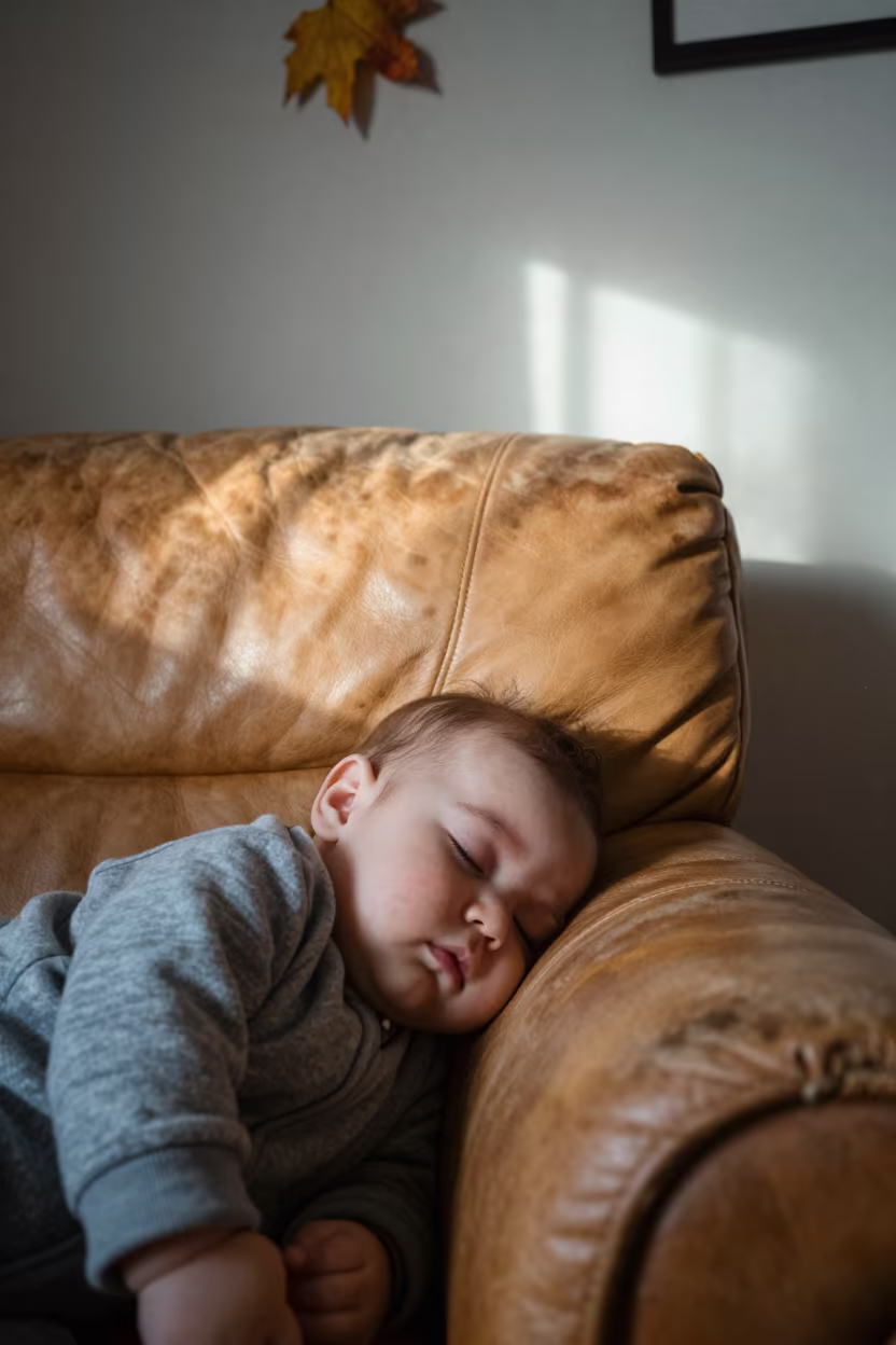 Sleeping Baby on Worn Leather Armchair in on a worn leather armchair in Çerkezköy district