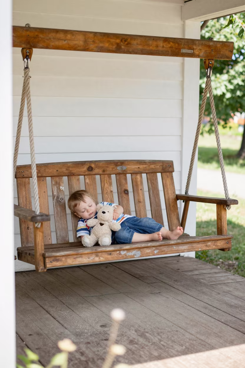 Sleeping Toddler on Porch Swing in Kaunas in in Kaunas