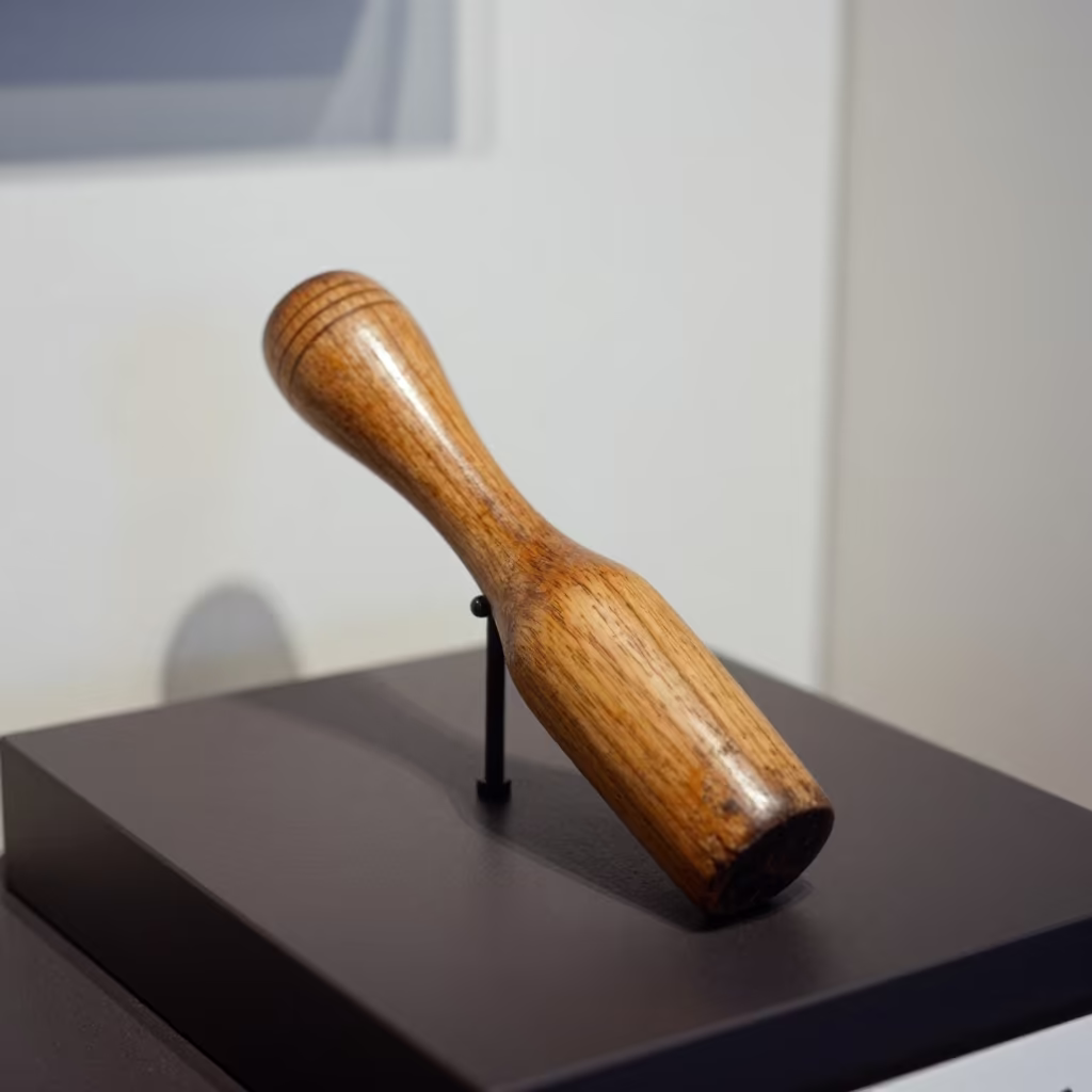 Smooth Wooden Dibber on Museum Plinth in on a museum plinth in 6th of October