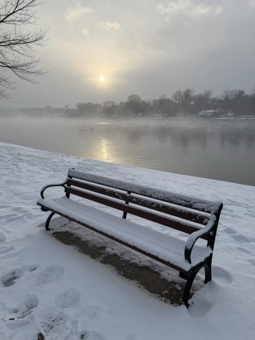 Snow Sculpture on Park Bench Under Mist in beneath fast-moving cloud bands near St Louis