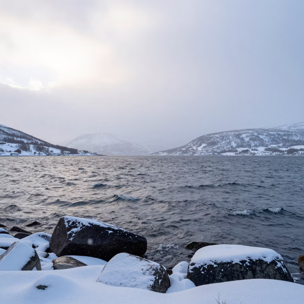 Snow Squall Drifting Over Arctic Lake at Midnight Sun in near Tromsø