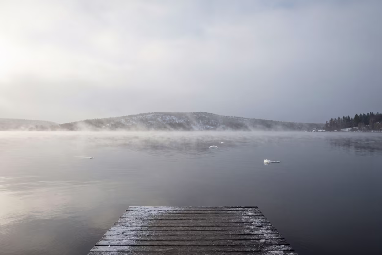 Snow Squall Crossing Lake in Early Spring Fog in through low marine fog near Helsinki