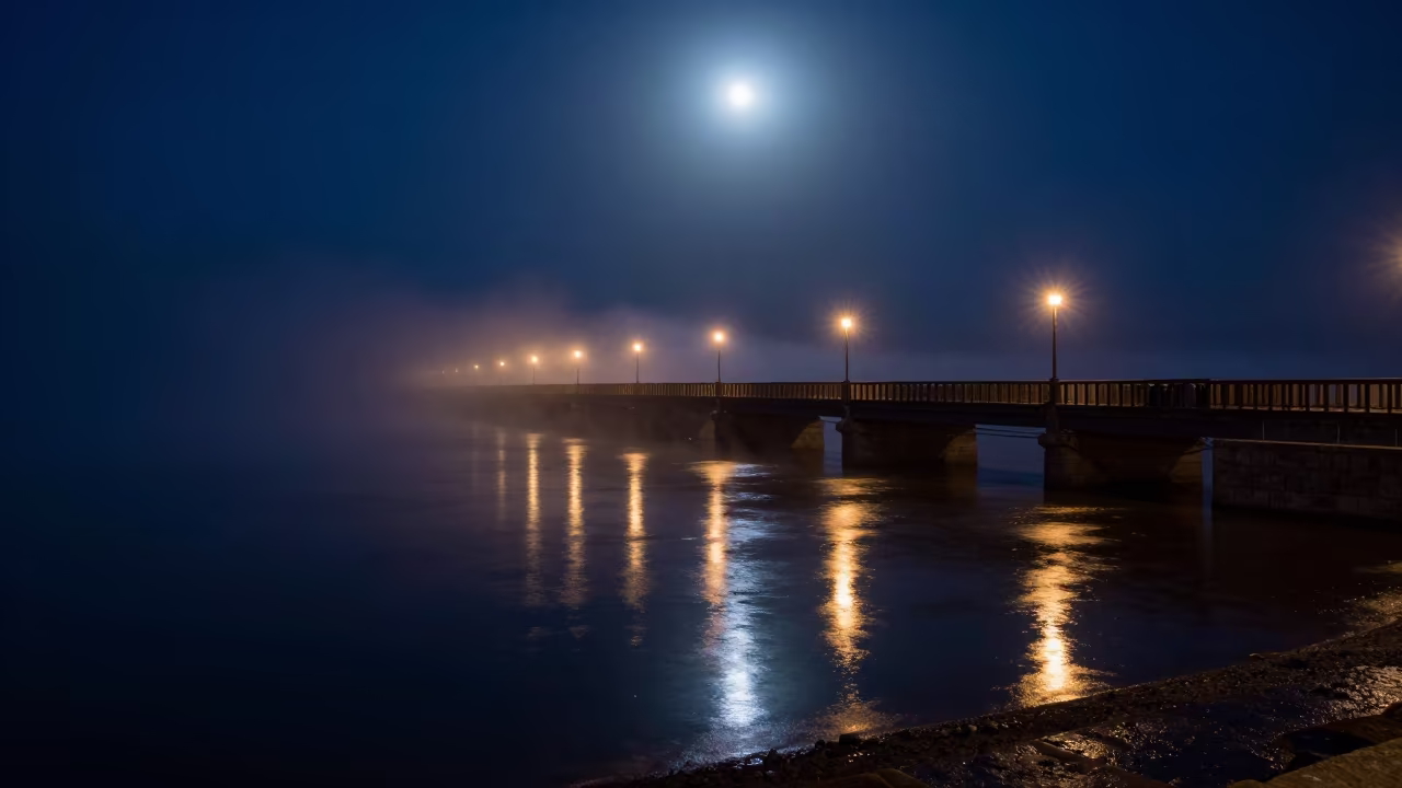 Somali Bridge Night Mist Reflections in beneath a moon-washed horizon in Somalia