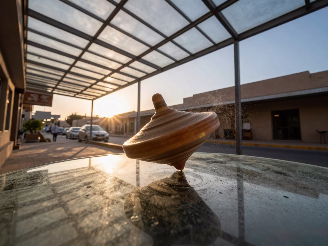 Spinning Top Light Trails on Glass Table in inside a glass-roofed arcade near Arish
