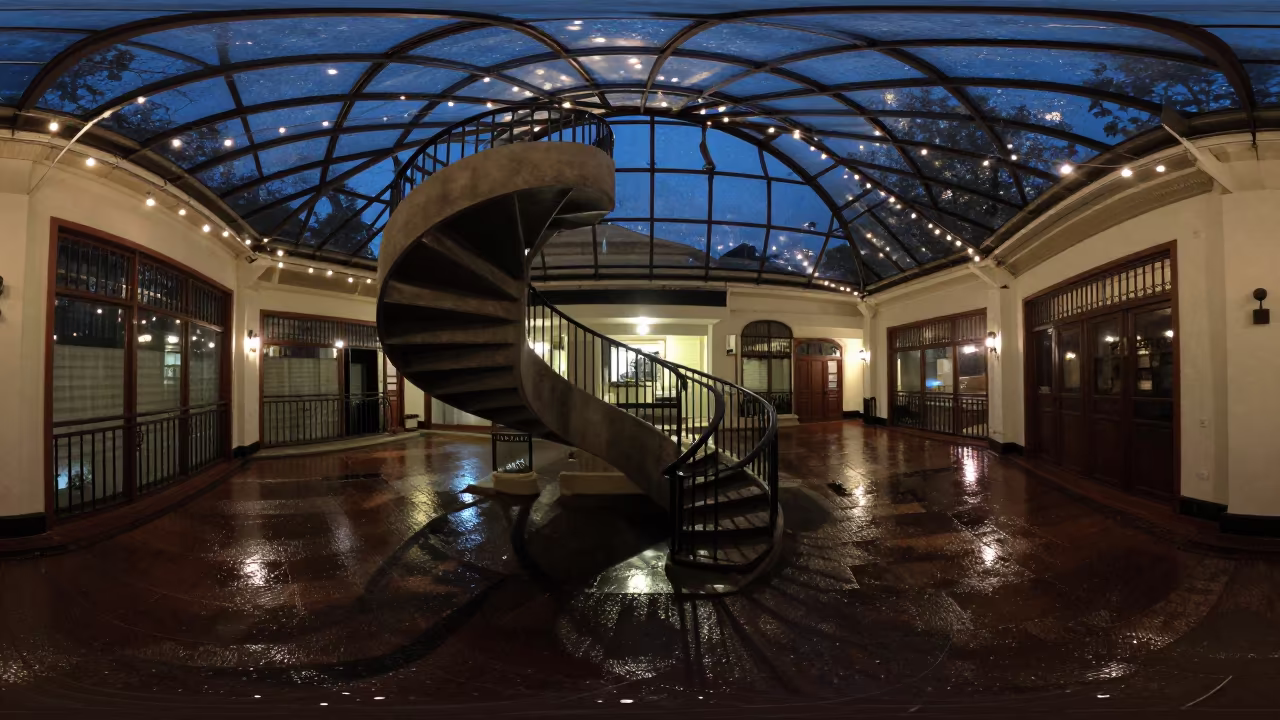 Spiral Staircase Shadow in Glass Arcade in inside a glass-roofed arcade in Burao