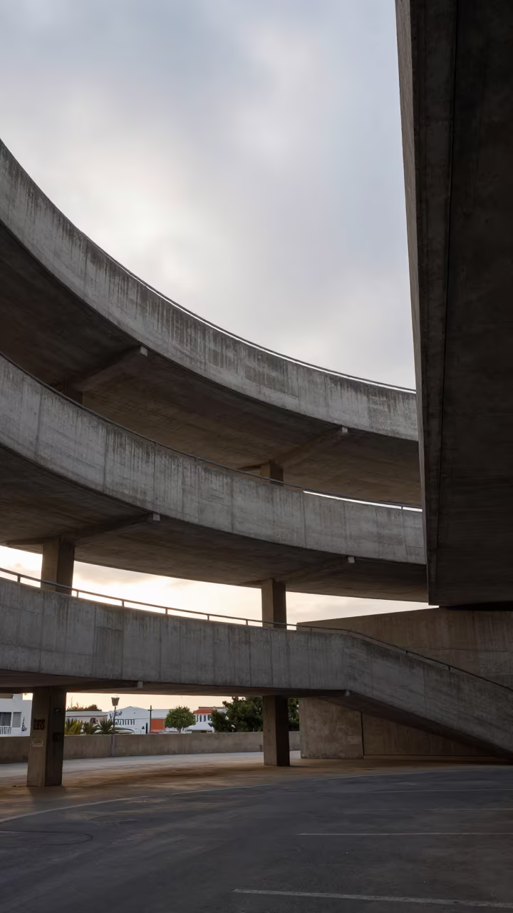 Spiraling Concrete Ramp at Dawn in Heraklion in inside a ribbed concrete lobby in Heraklion