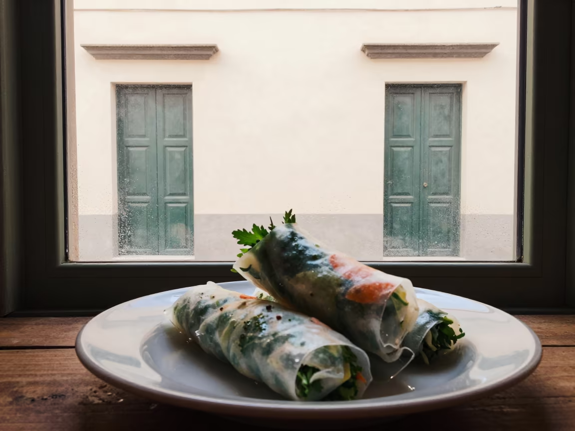 Spring Rolls and Endless Doors in Salerno in on a ceramic plate by a window in Salerno