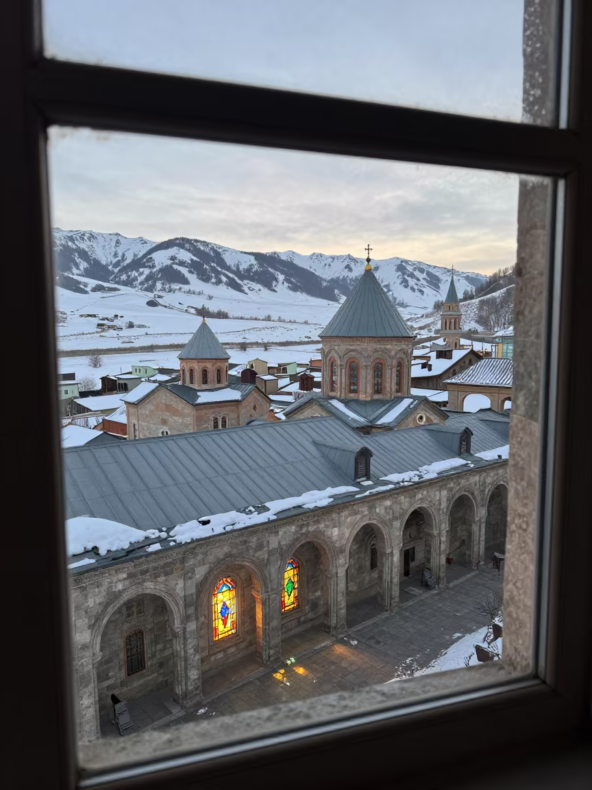 Stained Light on Winter Monastery Rooftops in along a monastery corridor in Almaty