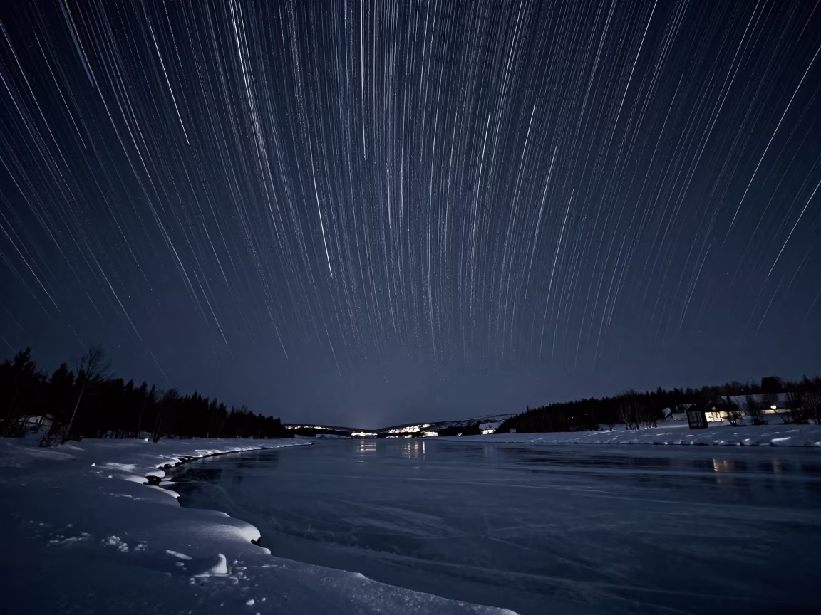 Star Trails Over Frozen River Bend Near Tromsø in under the clearest stretch of sky near Tromsø